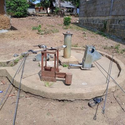 Village hand pump undergoing repair 